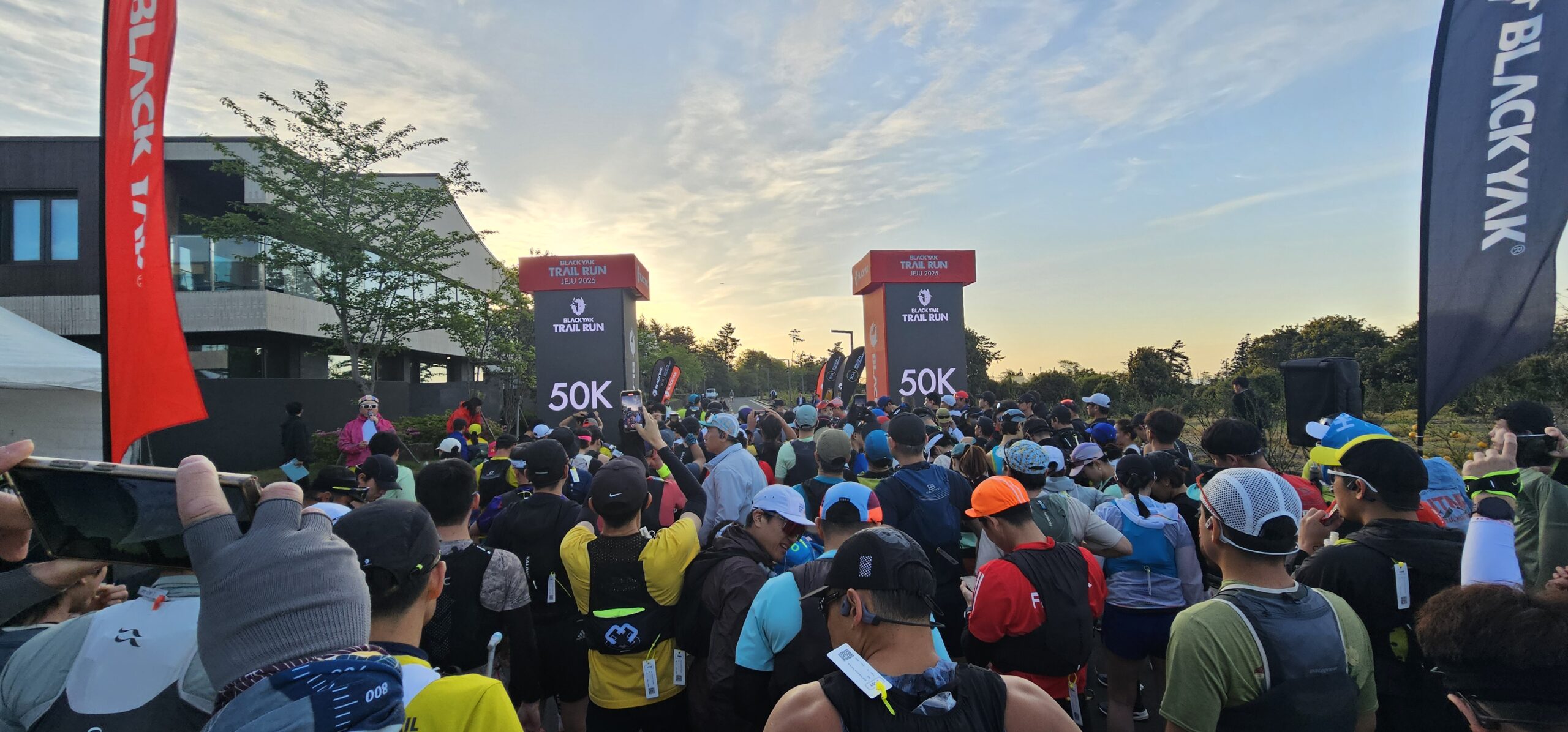 Start line of the Black Yak Jeju Trail Run with runners gathering at dawn, 2025.04.26